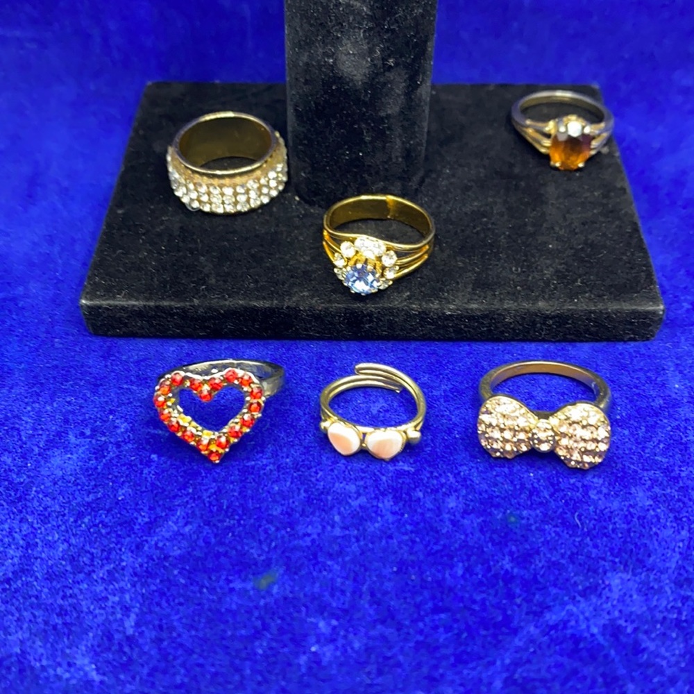 Lot of Gold tone rings Nice Casual glass stones. Rings on blue are non magnetic